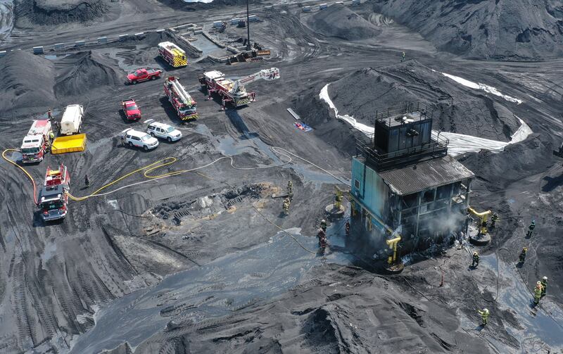 Firefighters work the scene of a third alarm fire on Monday, Aug. 18, 2025 at Washington Mills near Hennepin. A Mutual Aid Box Alarm System (MABAS) call was placed shortly after 11a.m. Fire departments from La Salle, Bureau and Putnam Counties assisted with the fire.