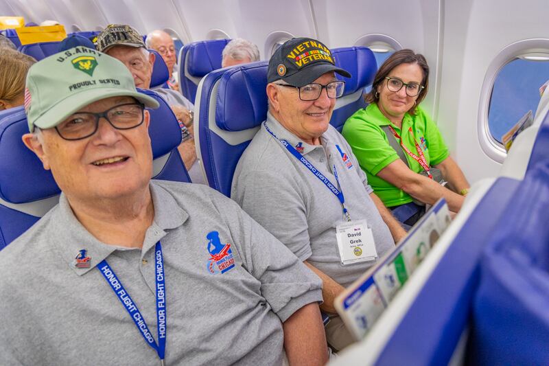 Former DeKalb mayor Jerry Smith, 82, (left), poses for a photo on a Chicago Honor Flight to Washington D.C. in August 2025, where he was part of an escort for Vietnam War-era veterans to visit national memorials and be recognized for their service.
