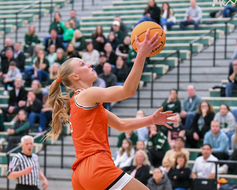 St. Charles East's Brooklyn Schilb (5) makes a layup while taking on Glenbard West during the 4A Sectional championship game on Thursday Feb. 26, 2026, held at Bartlett High School.
