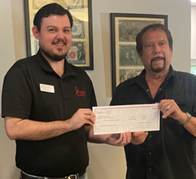 The Ogle County Historical Society (Mike Arians, right) recently received a donation from Harvard State Bank (Alexander Cremeans) in support of a time capsule project to commemorate the country’s 250th anniversary.