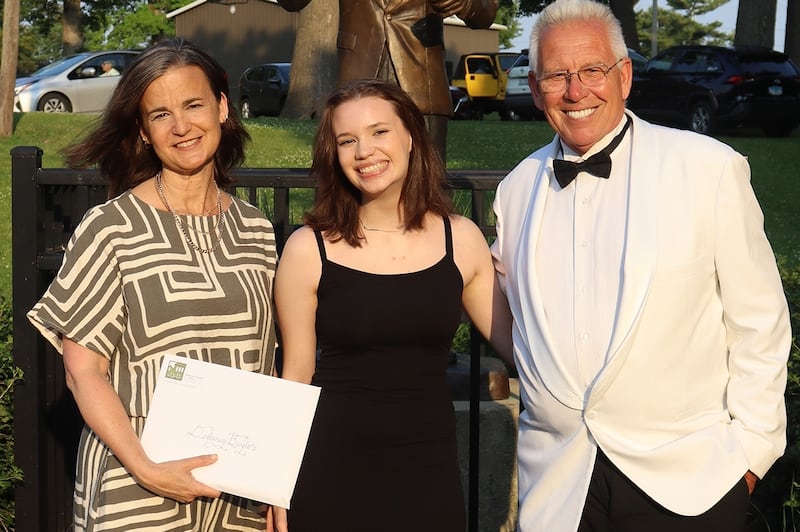 (Left to right); DeKalb County Community Foundation grants and scholarships manager Sara Nickels, Delaney Baylor, and DeKalb Municipal Band conductor Kirk Lundbeck