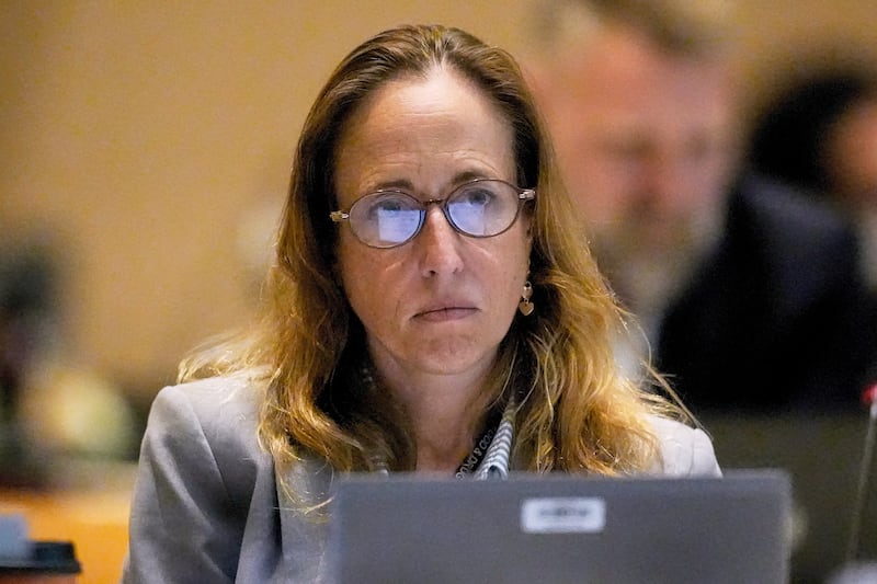 FILE - Dr. Tracy Beth Hoeg, with the FDA, listens during a meeting of the Advisory Committee in Immunization Practices at the CDC, June 25, 2025, in Atlanta. (AP Photo/Mike Stewart, File)