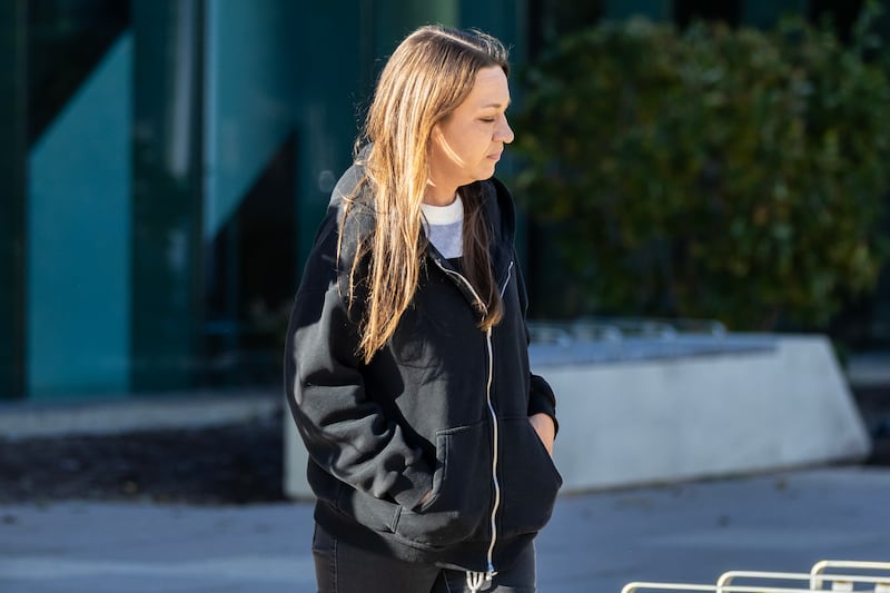 Amy Burgett-Masse, 45, of Elwood, exits the Will County Courthouse in Joliet on Oct. 29, 2025.