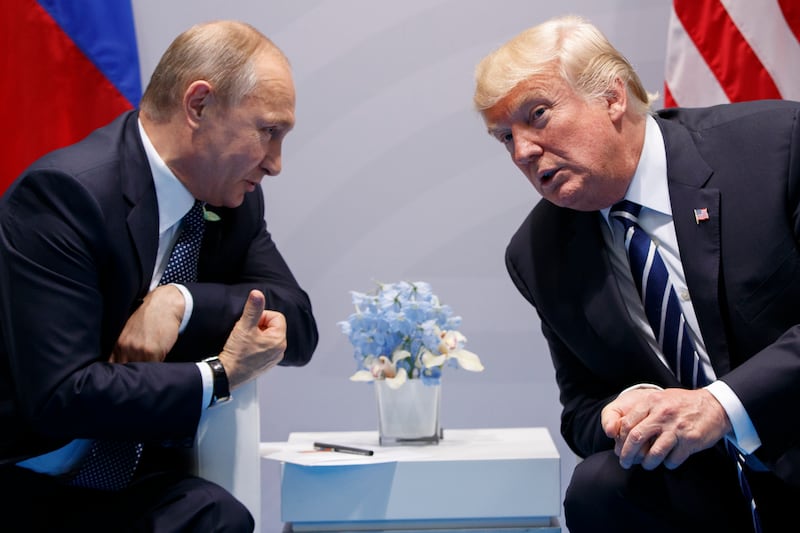 FILE - U.S. President Donald Trump meets with Russian President Vladimir Putin at the G-20 Summit on July 7, 2017, in Hamburg, Germany. (AP Photo/Evan Vucci, File)