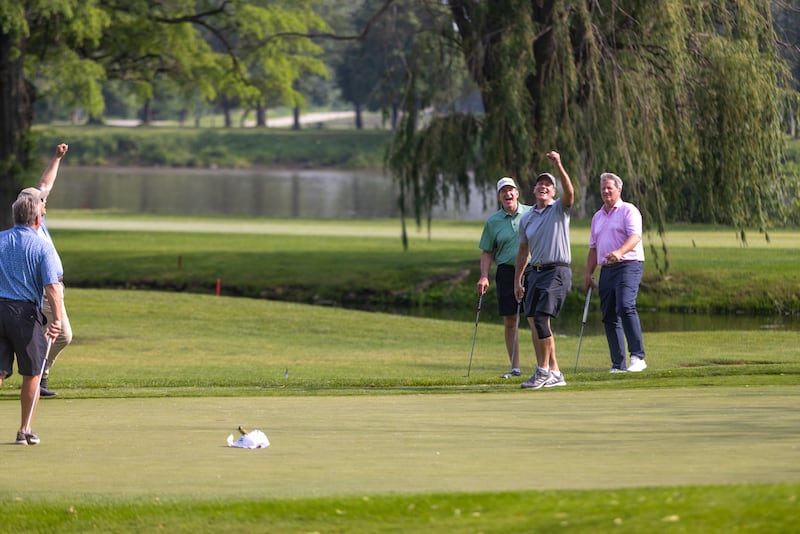 Phil Kambic, at right, president and CEO of Riverside Healthcare, celebrates with his foursome after sinking a putt during the 48th Annual Riverside Pro-Am on Friday, June 6, 2025.