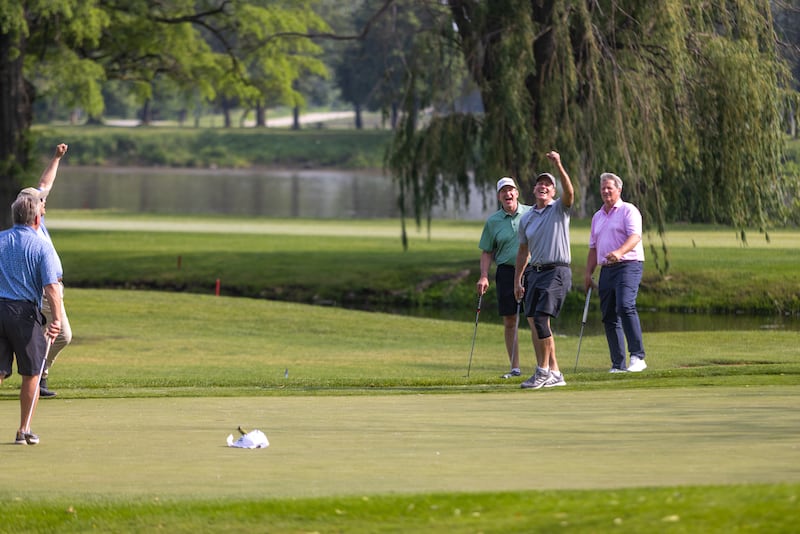 Phil Kambic, at right, president and CEO of Riverside Healthcare, celebrates with his foursome after sinking a putt during the 48th Annual Riverside Pro-Am on Friday, June 6, 2025.