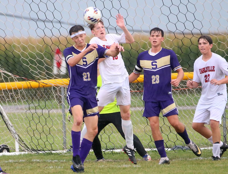 Serena's Nolan Muffler, and Earlville's Jeff Peterson, jump in the air for a header near the goal as Serena's Payton Twait, and Earlville's Rob Tinson, watches from behind on Wednesday, Sept. 3, 2025 at Serena High School.