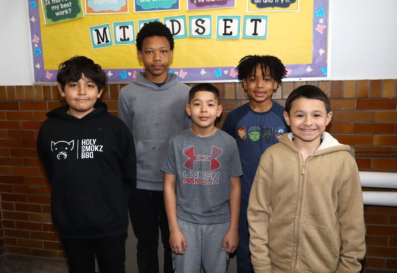 Second place team members in the Stock Market Game from A.O. Marshall Elementary School in Joliet. From left to right,  fifth-graders Hector Ortiz Calderon, Charon McNair, Marco Santana, Jamarr Lee, and Noah Guzman.
April 14, 2025.