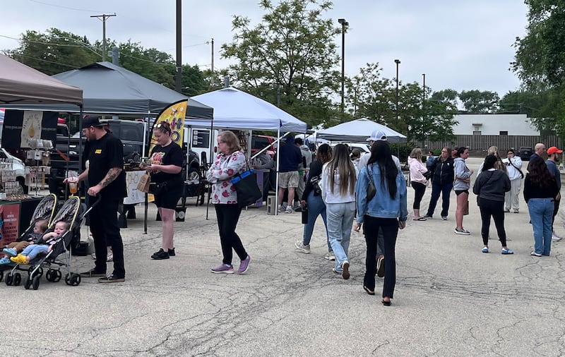 Attendees at the Lockport Trackside Farmers Market on Saturday, May 23, 2026, near the Lockport Metra train station parking lot.