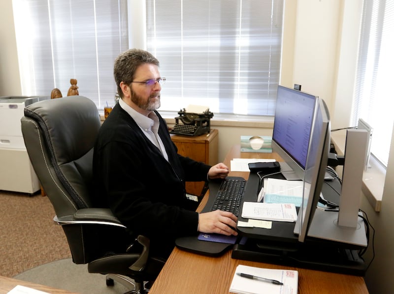McHenry County Clerk Joe Tirio works in his office the morning of Thursday, Jan. 20, 2022, in Woodstock, the day after the Illinois Supreme Court heard oral arguments in McHenry Township's court case against the Clerk's Office over the township's 2020 abolition attempt.