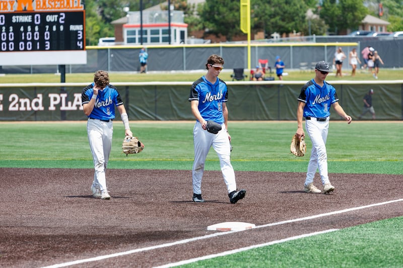 St. Charles North's Julian Harmon (5), Reed Raczka (6) and Nick Gnutek (21) walk off the field after Barrington's walk off win at the Class 4A McHenry Sectional Final on Saturday , June 6, 2026 in McHenry.