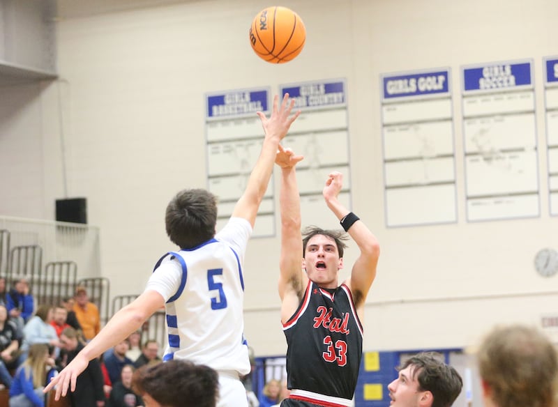 Hall's Braden Curran lets go of a three-point jump shot over Princeton's Jack Oester on Friday, Feb. 13, 2026 at Princeton High School.
