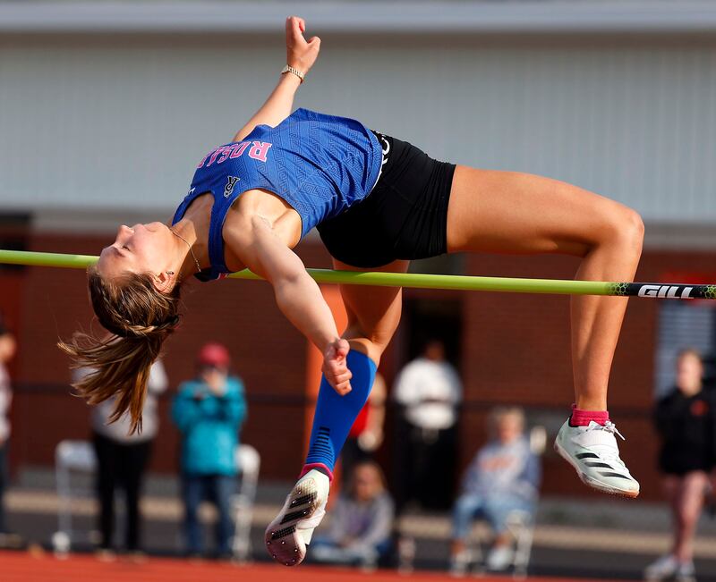 Katie Kostro of Rosary competes in the high jump during the Kane County girls track and field meet at East Aurora High School Friday, May 2, 2025 in Aurora Ill. Kostro took first.