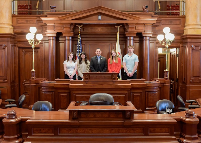 Four Polo students pose with State Senator Li Arellano Jr (R-Dixon), who welcomed them to Springfield for his Youth Advisory Council, giving them a firsthand look at how state government works.