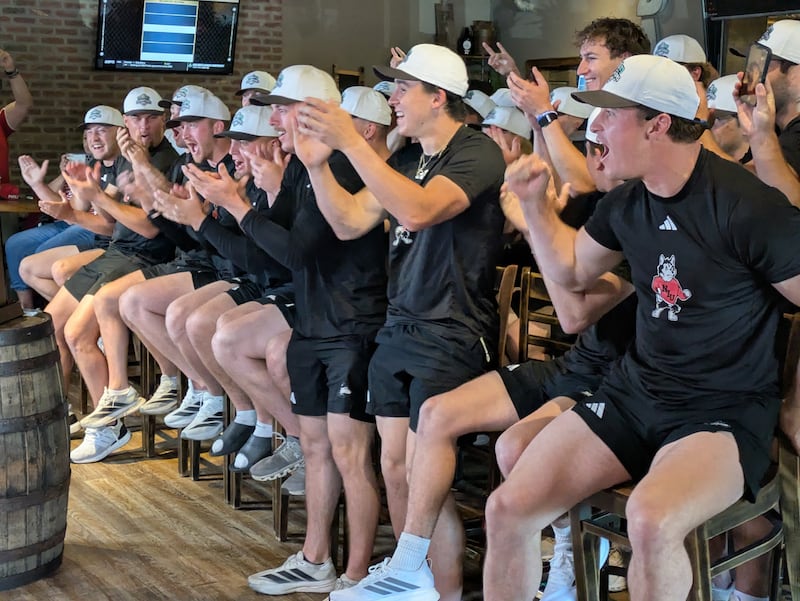 Players on the NIU baseball team cheer when their regional assignment for the NCAA Division I College World Series is announced on Monday, May 25, 2026.