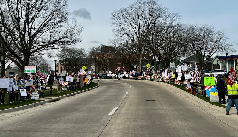 Hundreds of people gather in front of the Grandon Civic Center and the post office on Saturday, March 5, in Sterling, Illinois, to protest against President Donald Trump and his administration.