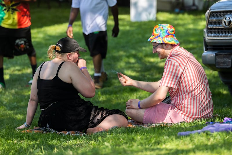 Julianna Howard and Joseph Scott of Dixon partake Friday, July 12, 2024 during Herbal Roots’ Cannafest at Elks Page Park. The two-day festival features vendors, music, glass blowers, food and, of course, cannabis.