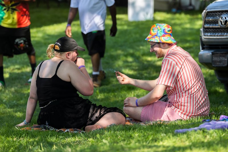 Julianna Howard and Joseph Scott of Dixon partake Friday, July 12, 2024 during Herbal Roots’ Cannafest at Elks Page Park. The two-day festival features vendors, music, glass blowers, food and, of course, cannabis.