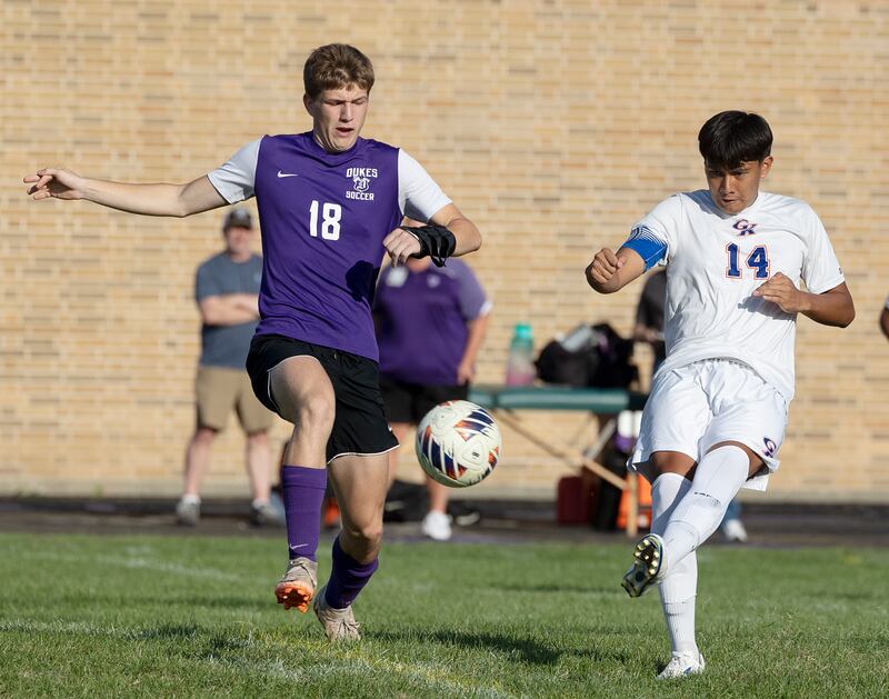 Dixon’s Ethan Bond and Genoa-Kingston’s Josue Leon work for the ball Tuesday, Sept. 2, 2025.