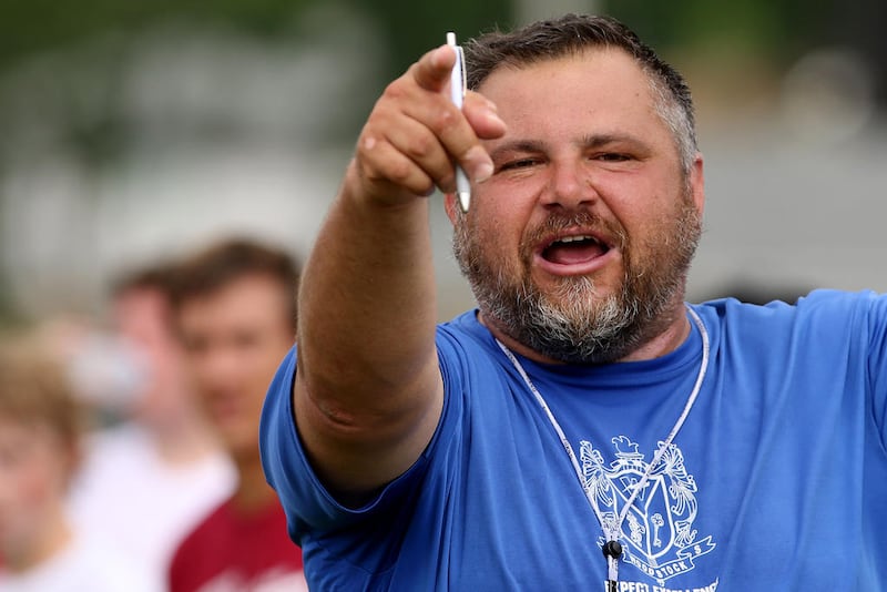 Woodstock coach Mike Brasile leads the Blue Streaks during practice July 3. Brasile, a Woodstock graduate, is entering his second season as the Blue Streaks' head coach.