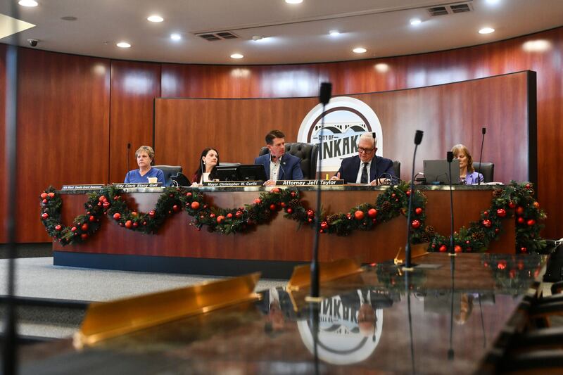 Kankakee Mayor Chris Curtis, center, participates in a recent Kankakee Electoral Board hearing. On Friday, the three-member board removed a 5th Ward aldermanic candidate.