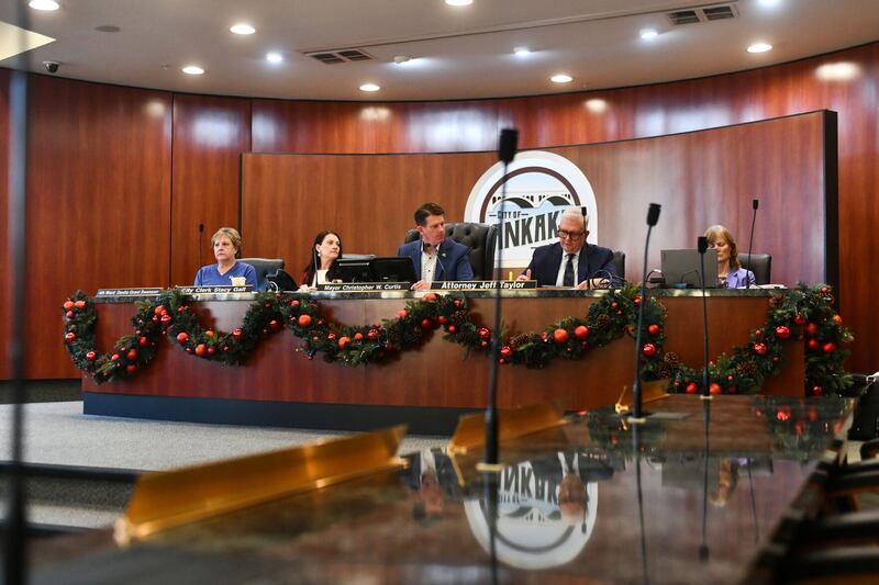 Kankakee Mayor Chris Curtis, center, participates in a recent Kankakee Electoral Board hearing. On Friday, the three-member board removed a 5th Ward aldermanic candidate.