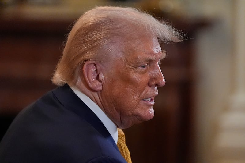 President Donald Trump greets people during a reception for Republican members of Congress in the East Room of the White House, Tuesday, July 22, 2025, in Washington. (AP Photo/Julia Demaree Nikhinson)