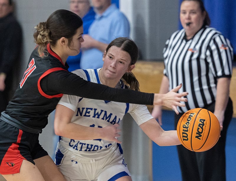 Newman’s Lucy Oetting makes a pass while being guarded by Stillman Valley’s Emma Withers Monday, Feb. 2, 2026.