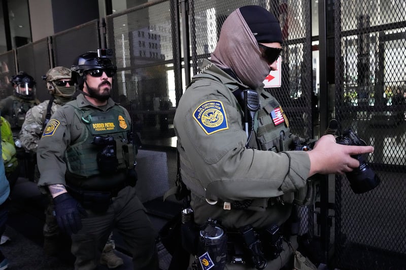 U.S. Customs and Border Patrol agents arrive to escort U.S. Customs and Border Patrol Gregory Bovino from federal court in Chicago, Tuesday, Oct. 28, 2025. (AP Photo/Nam Y. Huh)