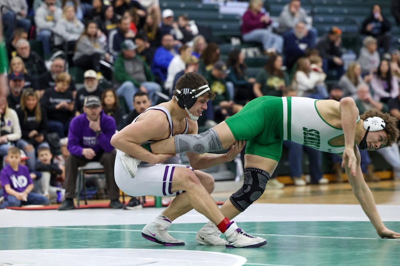 Wilmington's Logan Van Duyne, left, wrestles Seneca's Landen Venecia in the 190-pound championship match during the IHSA Class 1A Coal City Sectional on Saturday, Feb. 14, 2026.