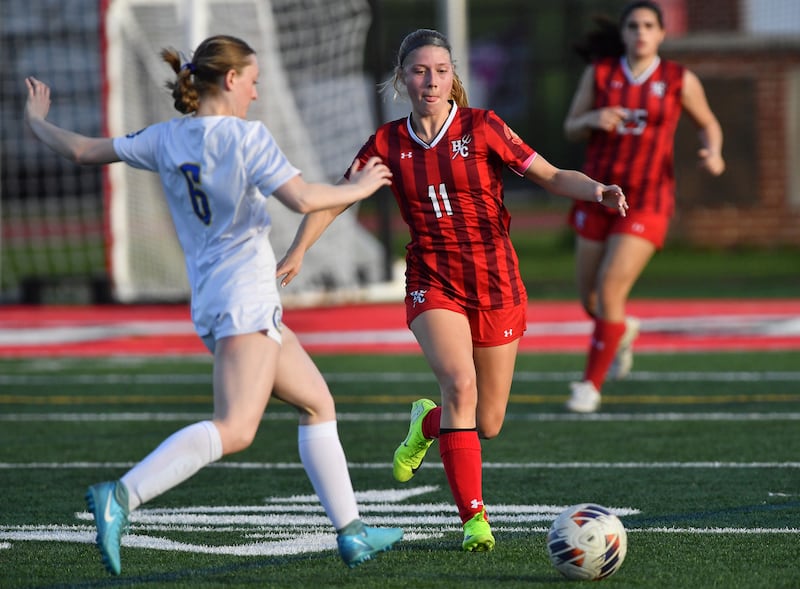 Hinsdale Central’s Peyton Rohn (11) contends for the ball with Lyons Township’s Grace Lanspeary (6) during a game on April 29, 2025 at Hinsdale Central High School in Hinsdale.