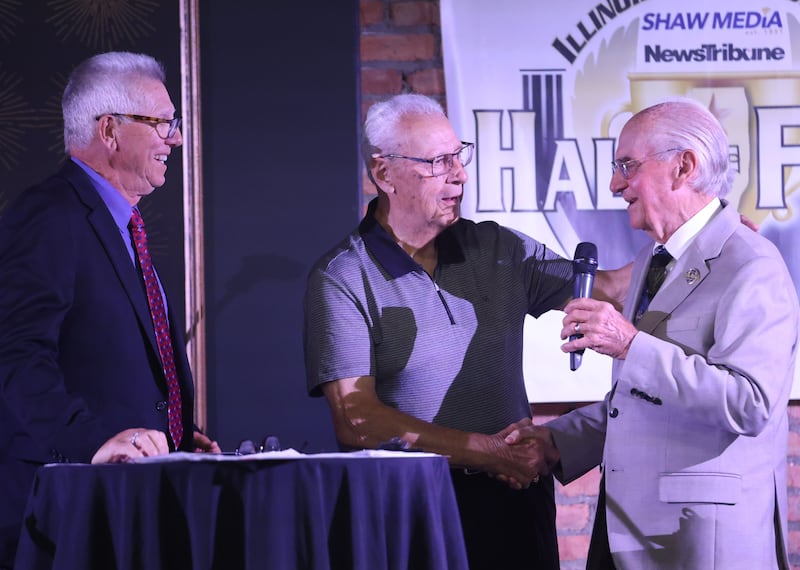 La Salle-Peru High School 1979 football assistant coaches Bruce Bawer and Jerry Panizzi talk with Lanny Slevin during the 7th annual Shaw Media Illinois Valley Sports Hall of Fame on Thursday, June 4, 2026 at the Auditorium Ballroom in La Salle.