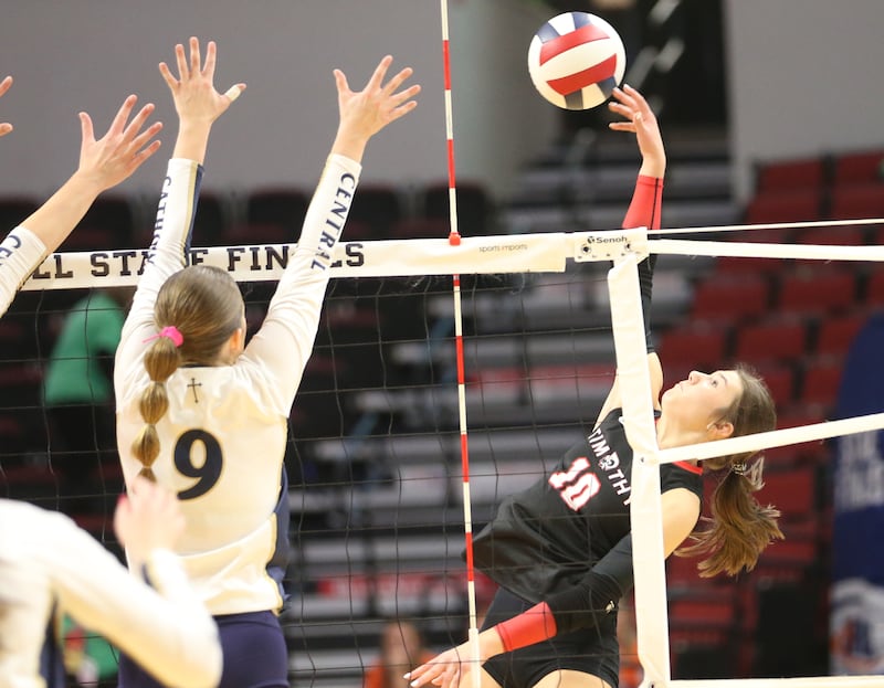 Timothy Christian's Bella Potempa sends a kill past Bloomington Central Catholic's Lauren O'Brien during the Class 2A State semifinal game on Friday, Nov. 15, 2024 at CEFCU Arena in Normal.
