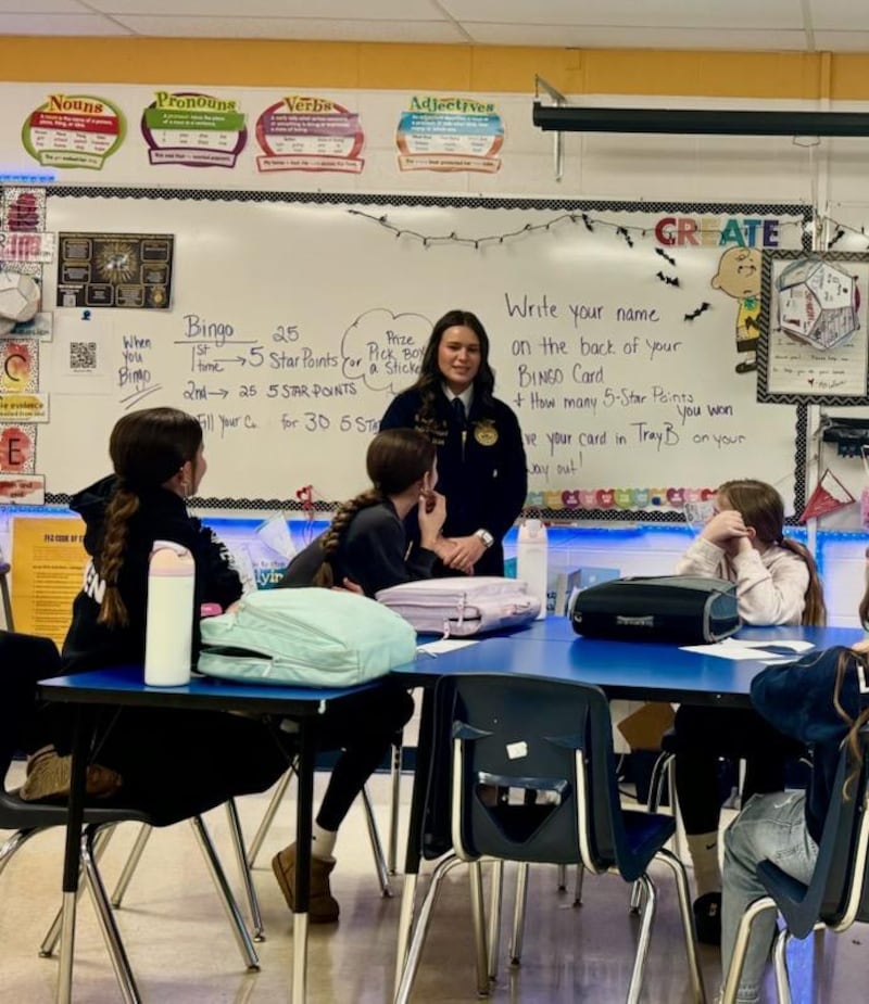Illinois FFA State President Natalie Pratt tests the FFA knowledge of seventh grade agriculture students at Challand Middle School in Sterling on Friday. Pratt, Illinois FFA State Secretary Kyle Bradshaw and Section 2 President Jack Heinzeroth visited Julie LeFevre's agriculture classes in preparation for National FFA Week.