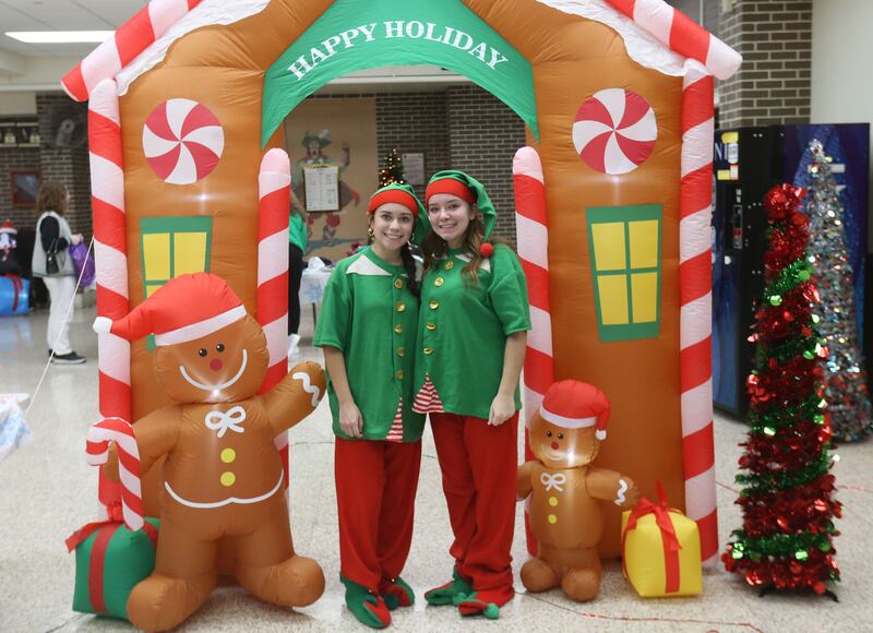 La Salle-Peru Township High School students Stacie Albiter and Sophia Ploch dress as Elves while greeting visitors to the Santa's Workshop event on Saturday, Dec. 7, 2024 at L-P High School.