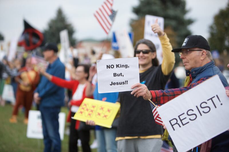 Locals gather at the NO Kings rally along Randall Rd. on Saturday, Oct.18,2025 in Geneva.