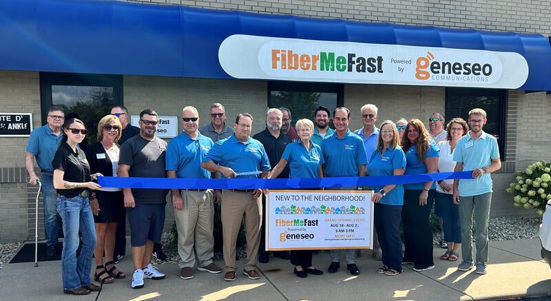 FiberMeFast representatives, Illinois Valley Area Chamber of Commerce members and local city officials gather for a ribbon-cutting Wednesday at the Janko Center in Peru, marking the opening of FiberMeFast’s new office.