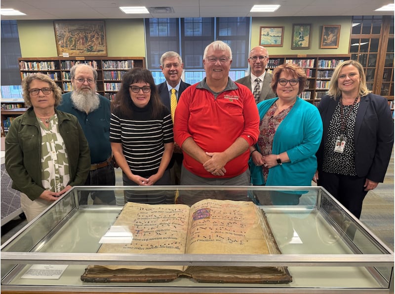Rob McNally with members of the L-P District 120 Board of Education. The board voted to name the swimming pool in the east building in his honor, dubbing it the Rob McNally Pool.