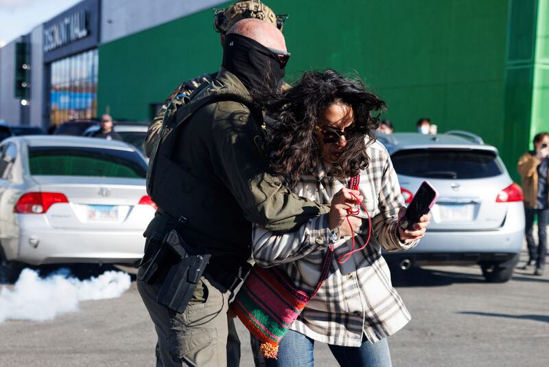 Federal immigration enforcement agents detain a protester in Little Village neighborhood, Chicago Thursday, Oct. 23, 2025. (Anthony Vazquez  /Chicago Sun-Times via AP)