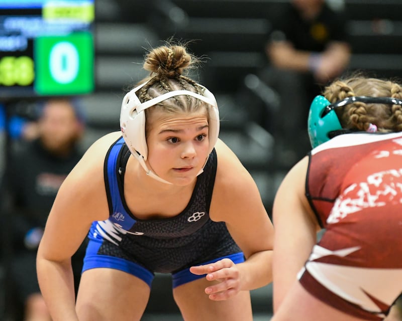 Sterling Newman Central Catholic’s Blair Grennan keeps her focus on Erie’s Rozlyn Mosher during the 110-pound weight class regional championship match held on Saturday Feb. 14, 2026, held at DeKalb High School.