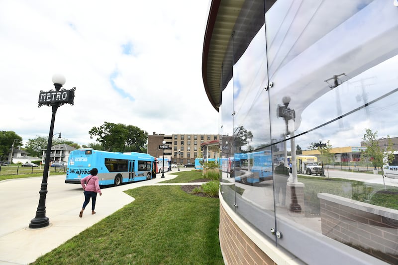 Riders board River Valley Metro buses at the Kankakee Metro Centre bus transfer station on Chestnut Street in downtown Kankakee in August 2023.