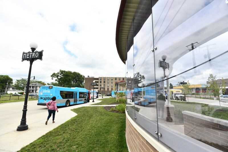 Riders board River Valley Metro buses at the Kankakee Metro Centre bus transfer station on Chestnut Street in downtown Kankakee in August 2023.