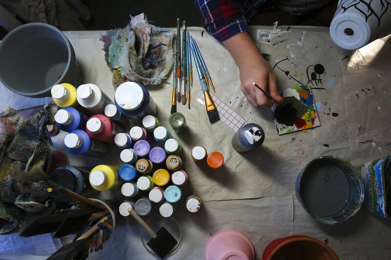 As part of RejuveNate – Plants and Wellness, Ashley wants to host classes and talks on mental health.  Ashley said people are often hesitant to discuss mental health. She wants that to change.

“It affects more people than you think,” she said.

Nor does Ashley want to limit the education and conversation to just adults.

“I want to take it to schools and put on little presentations and just have kid friendly mental health talks,” Ashley said. “I think if we started educating kids on mental health topics and talking about our feelings, how to express ourselves in positive way, I think that can, possibly, eliminate a lot of adult disorders that go untalked about, even undiagnosed.”

Above, Ashley Searing mixes paint on Thursday, Nov. 12, 2020, at her home in Joliet, Ill.