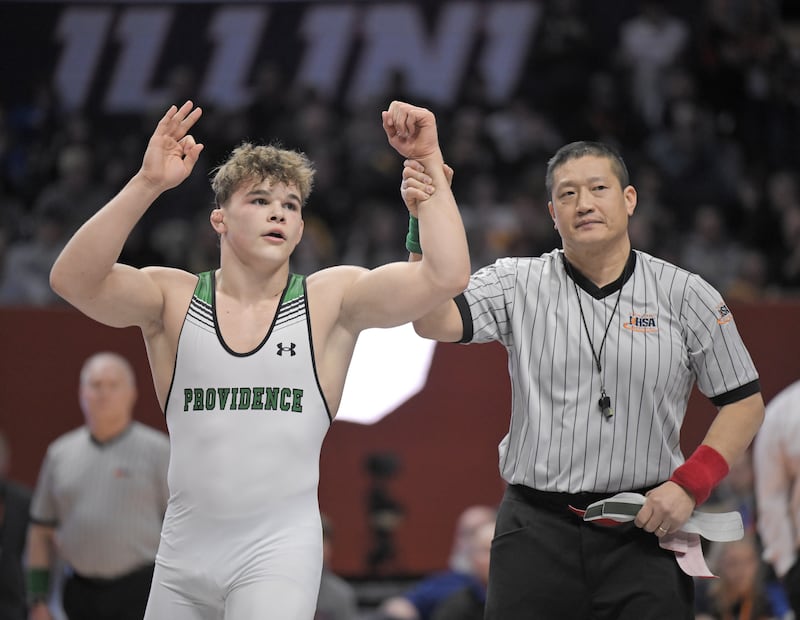 Providence Catholic’s Justus Heeg celebrates his win in the Class 3A 157-pound match at the boys IHSA wrestling finals at State Farm Center in Champaign on Saturday, Feb. 21, 2026.