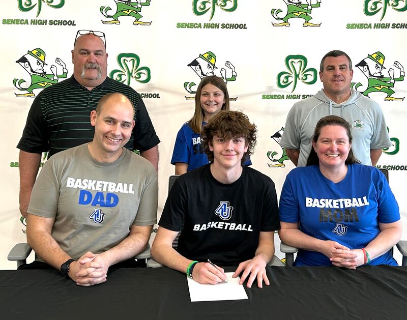 Recent Seneca High School graduate Sebastian Deering has committed to continue his education at Aurora University and his basketball career at the NCAA Division III level with the Spartans. Deering (seated, at center) is pictured here bookended by parents Jon and Sandy Deering, while standing behind are (left to right) former Seneca coach Russ Witte, Harper Deering and Seneca AD Ted O'Boyle.