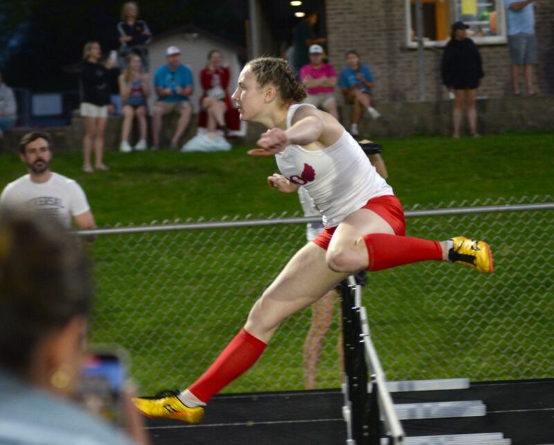Oregon's Jillian Hammer clears a hurdle in the home stretch of the 300 hurdles to finish first at the 1A Lena-Winslow sectional on Thursday, May 15, 2025. She will compete at the state meet this week at Eastern Illinois University in Charleston.