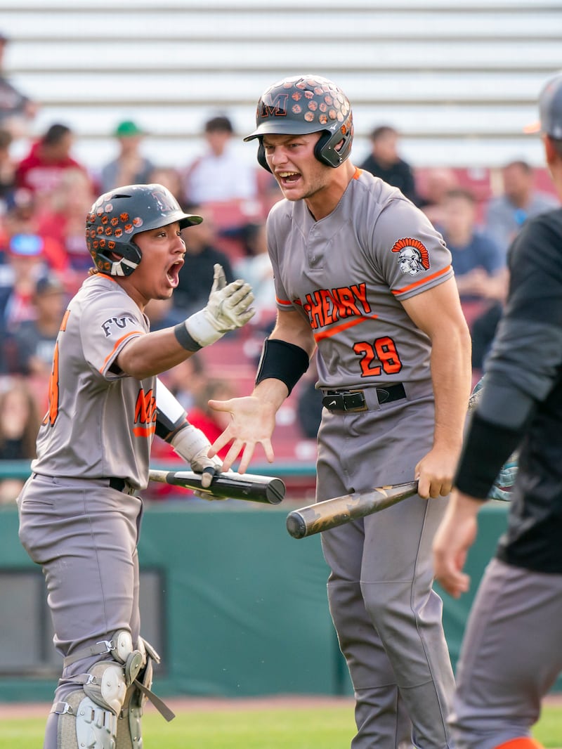 McHenry's A.J. Chavera, left, and Connor McLean celebrate a run by McLean during the boys baseball Class 4A Kane County Cougars Supersectional against South Elgin on Monday, June 9, 2025 at Northwestern Medicine Field in Geneva. Ryan Rayburn for Shaw Local