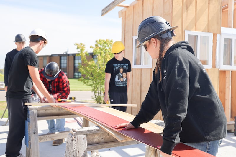 Jeffrey Policheri, back left, Huntley High School sophomore; Jack Goers, left with back to camera, Huntley High School sophomore; James Allen, GeoCon teacher, center; Stephen Fusco, second from right, Huntley High School Sophomore; Mya Ouimette, right, Huntley High School sophomore work on a GeoCon build in Huntley Friday, May 8, 2026.