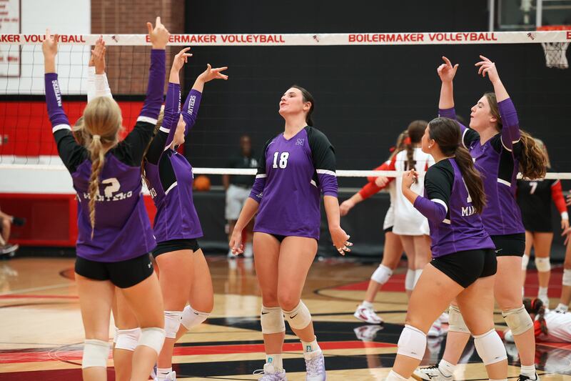 Manteno's Maddie Gesky, center, is celebrated by teammates after a kill during the Panthers' victory in three sets over Bradley-Bourbonnais, 25-21, 23-25, 25-17, on Monday, Sept. 15, 2025.