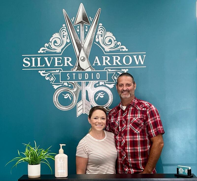 Tasha and Ben Foster stand behind the counter of their new hair salon, Silver Arrow Studio, at 121 W. First St. in Dixon.